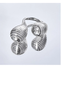 Detail shot of silver titanium steel ring featuring ribbed double teardrop ends