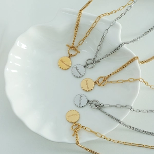 Minimalist gold and silver OT buckle necklaces with Beloved engraved round pendants