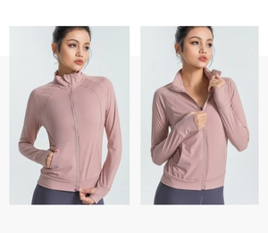 Detail of slim-fit yoga jacket with thumbhole cuffs and a stand collar in dusty rose