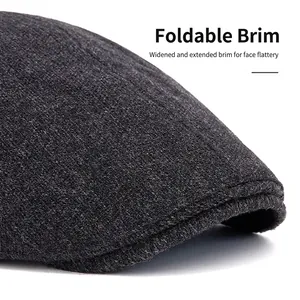 Deep grey wool flat cap with adjustable wide brim for a classic British retro look