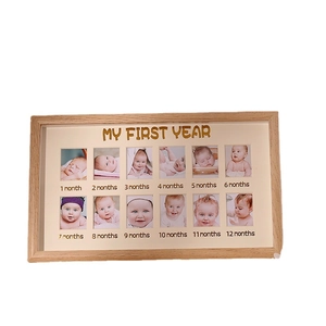 My First Year wooden baby photo frame with 12 monthly slots for growth milestones