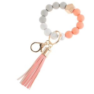 Silicone beaded keychain bracelet with wood hexagon bead and pink leather tassel detail