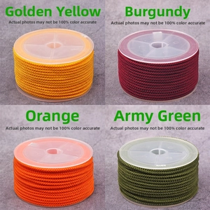 Detailed view of 2mm braided pineapple cords in gold, wine red, orange and army green
