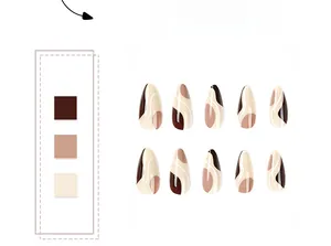 Detail of vintage brown and cream press-on nails with abstract patterns and curved blocks