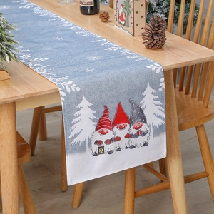 Light blue Christmas burlap table runner with cute cartoon gnomes and white snowflake patterns