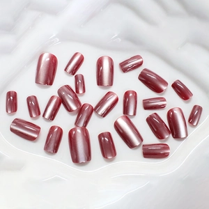 Deep red cat eye false nails set with metallic shimmering aurora effect on 24 press-on pieces