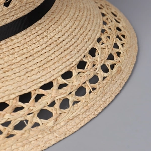 Hollow out raffia dome straw hat with black ribbon detail for summer beach vacations