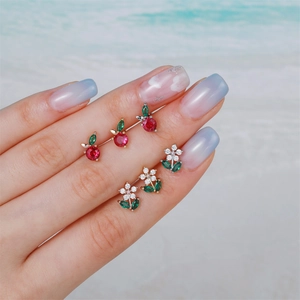 Exquisite cherry and floral stud earrings with sparkling crystals on a golden base