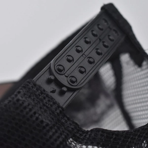 Detail view of the black snapback closure and breathable mesh on the baseball cap