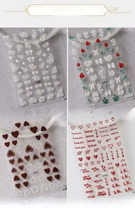 Detailed 5D embossed nail art stickers with 3D floral and heart motifs in four designs