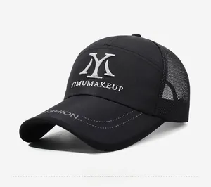 Close-up of black mesh baseball cap with white YM embroidery and fashion lettering