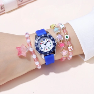 Close-up of a blue silicone watch with colorful numerals and beaded bracelets on a wrist