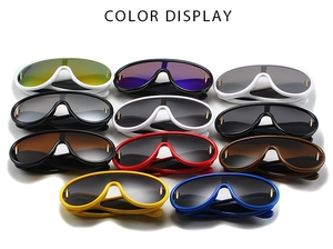 Multiple colorful Y2K oversized wrap sunglasses stacked on a clean white background
