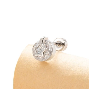 Silver star hollow stud earring with brilliant zircon inlay on a soft beige background
