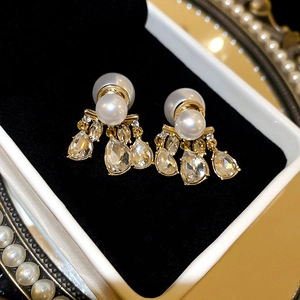 Elegant gold drop earrings with large white pearls and water-drop crystal accents