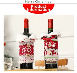 Detailed view of knitted Christmas wine bottle covers with reindeer and snowflake patterns