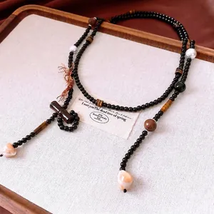 Ethnic beaded long necklace with tiger eye stone and bamboo-style shell pendant
