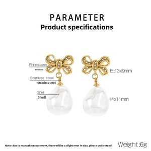 Close-up of golden bow earrings with sparkling rhinestones and teardrop shell pearls