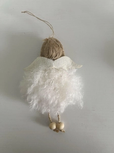 Detailed view of handmade Christmas angel ornament with plush fur and wooden beads