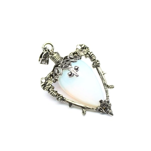 Detail of heart labradorite pendant with opal stone in vintage silver rose frame