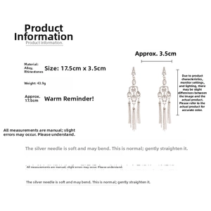 Detail showing elegant teardrop rhinestone earrings with long tassels and silver posts