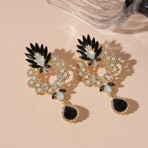 Vintage floral geometric drop earrings with gold frame and black crystals on beige