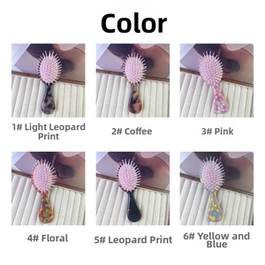 Detailed view of six stylish acetate air cushion hair brushes in various colorful patterns