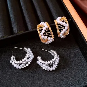 French vintage 18k gold plated C-shaped pearl earrings with elegant woven metal frame