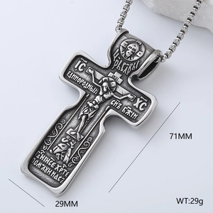 Detailed macro view of punk hip hop cross pendant with size markers 71mm by 29mm