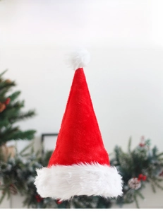 Detailed view of the soft plush lining and thick white faux fur trim on a red Santa hat