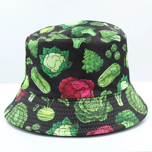 Detail shot of black bucket hat featuring vivid vegetable patterns and stitched brim