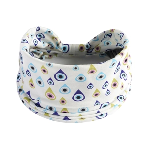 Macro detail of white yoga headband featuring colorful eye patterns on soft fabric