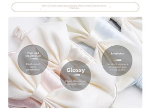Detail of silk satin sleep masks with large bow knots in pastel cream, blue, and pink colors