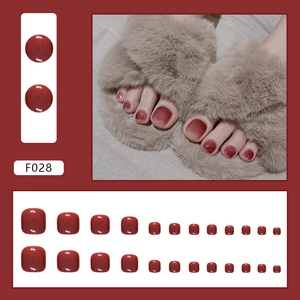 Deep wine red glossy press-on toenails set featuring a polished jelly finish