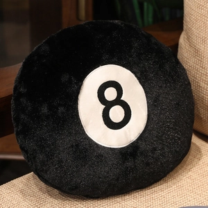 Close-up of the ultra-soft black velvet texture and number 8 on the billiard ball pillow