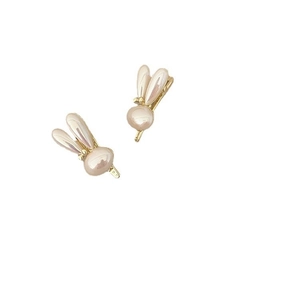 Elegant pair of pearl rabbit hair clips with golden ears on a clean white background