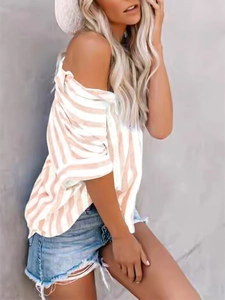 Detail of pink and white striped off-the-shoulder shirt with casual half sleeves
