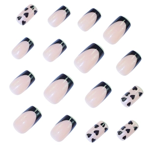 Classic black French tips and heart pattern press-on nails in short square shape