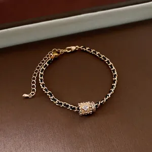 Luxurious gold-tone cylinder flower pendant necklace with elegant woven chain