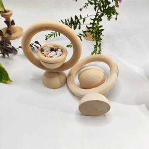 Vertical wooden ring essential oil diffuser with decorative stones on white background