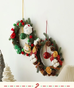Detailed close-up of festive Christmas wreaths with plush toys and natural pine cones