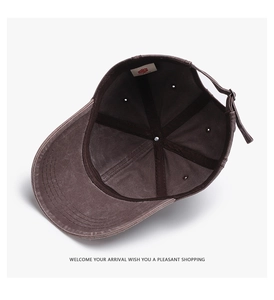 Detail of washed canvas baseball cap showing interior structure, sweatband, and adjustable strap