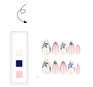 Close-up of short almond fake nails featuring blue floral patterns and pink gradients