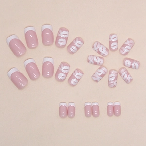 Elegant white French tip press-on nails featuring a sexy lip print design on pink base