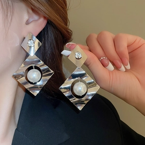Exaggerated geometric diamond-shaped earrings with pearls and crystals in silver finish