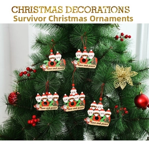 Detail of wooden 2021 Christmas tree ornament featuring masked snowman with love and peace text