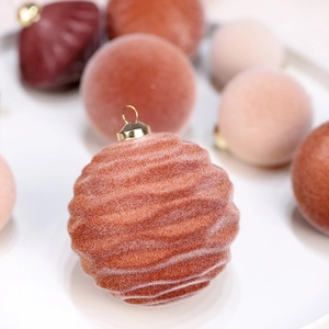 Set of 35 flocked velvet Christmas balls in orange and pink for festive tree decoration