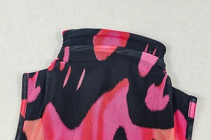 Detailed view of high neck mesh dress with vibrant pink and black abstract print
