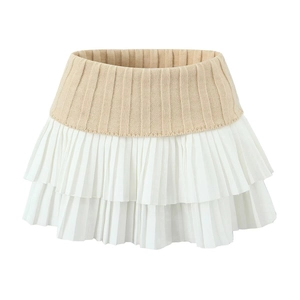 Sweet knit mini skirt featuring a beige ribbed waistband and white pleated layered hem