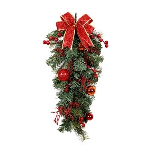 Christmas upside down tree with red bow, golden balls and red berries on white background